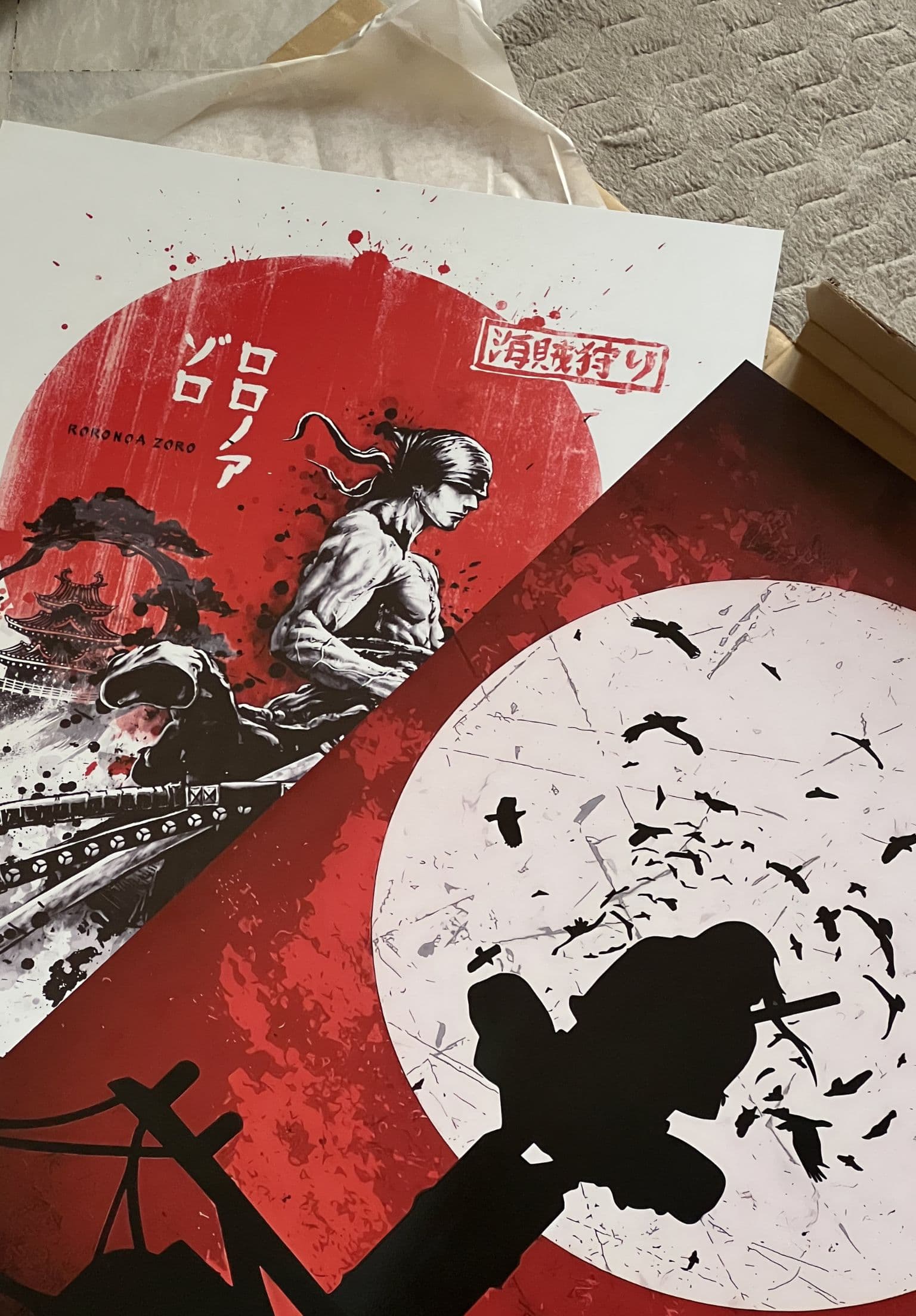 Community metal prints — Zoro and Itachi designs on display